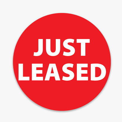Generic JUST LEASED Sticker (ROUND) - Red shown on a real estate signboard